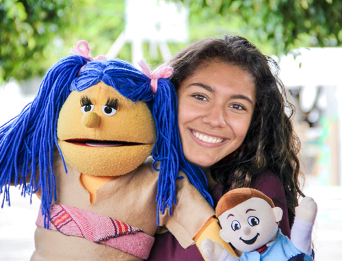 Girl with puppet at Service Adventure