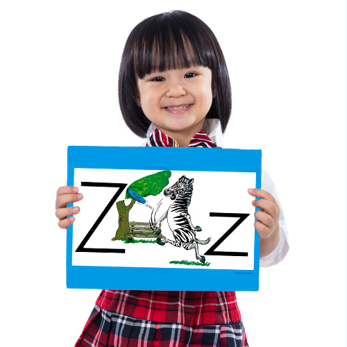 student holding ABCs display card